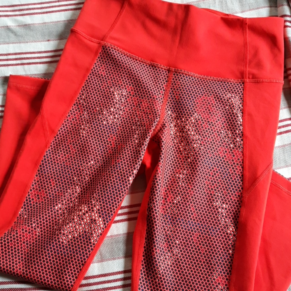 Bright orange and black UA leggings NWOT!